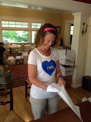 Cyndie (a.k.a. my mental and technical savior the past week or so) dressed the part while stuffing envelopes.