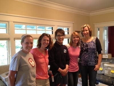 Some of the assembled mother runners who selflessly helped out stuffing packages, sticking on labels, and offering technical support. And that's Emily, my mail carrier, in the middle. She's been my BFF the last two weeks!