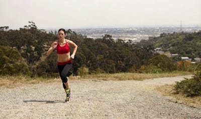 running in sports bra only