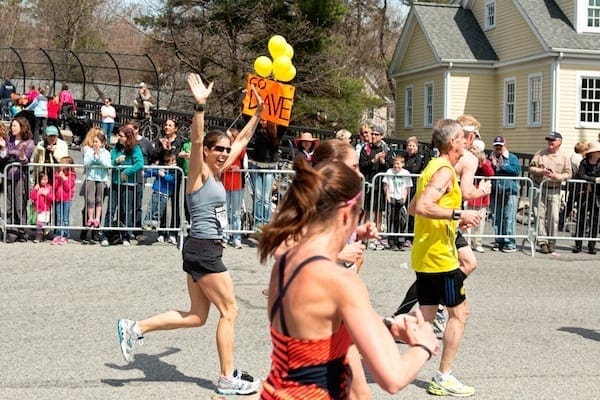 Woman running 2012 Boston Marathon