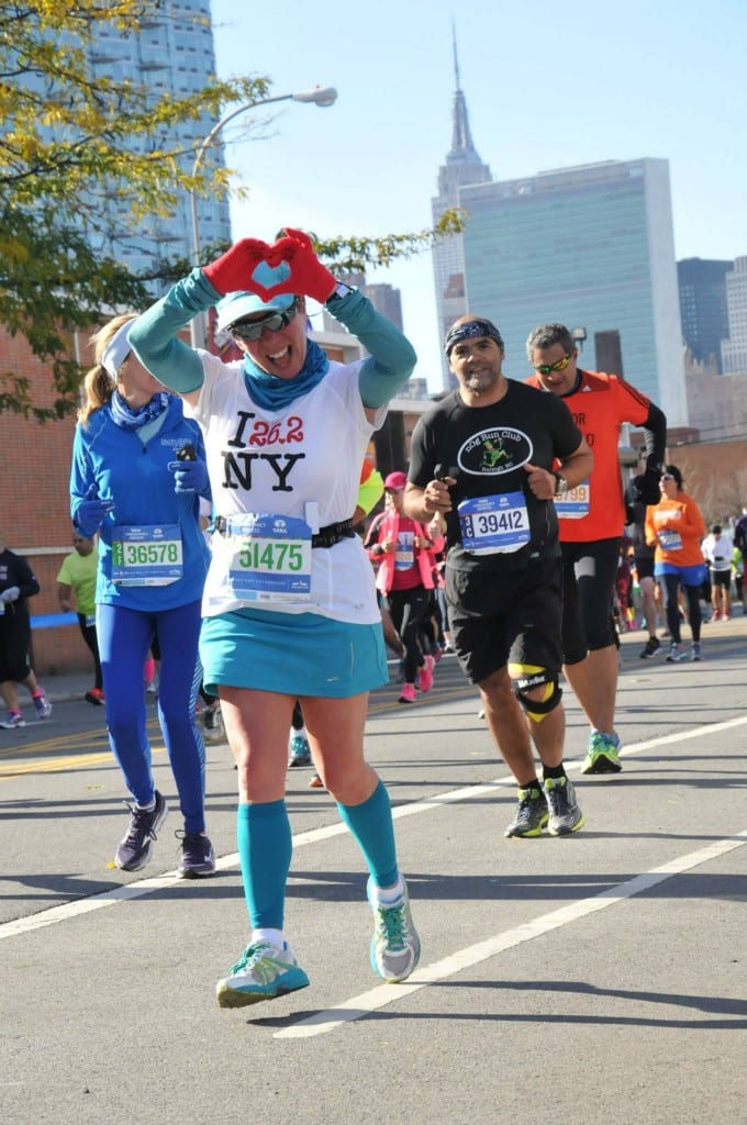 Terri hearting every step of the 2014 NYC Marathon.