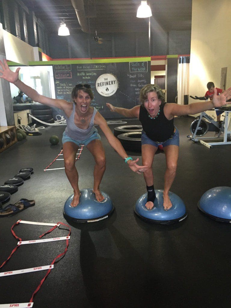 Sarah (ankle brace) and Dimity going a bit bonkers on a BOSU at Portland's The Refinery, where Sarah has resumed getting her sweat on twice a week in a barre-style class.