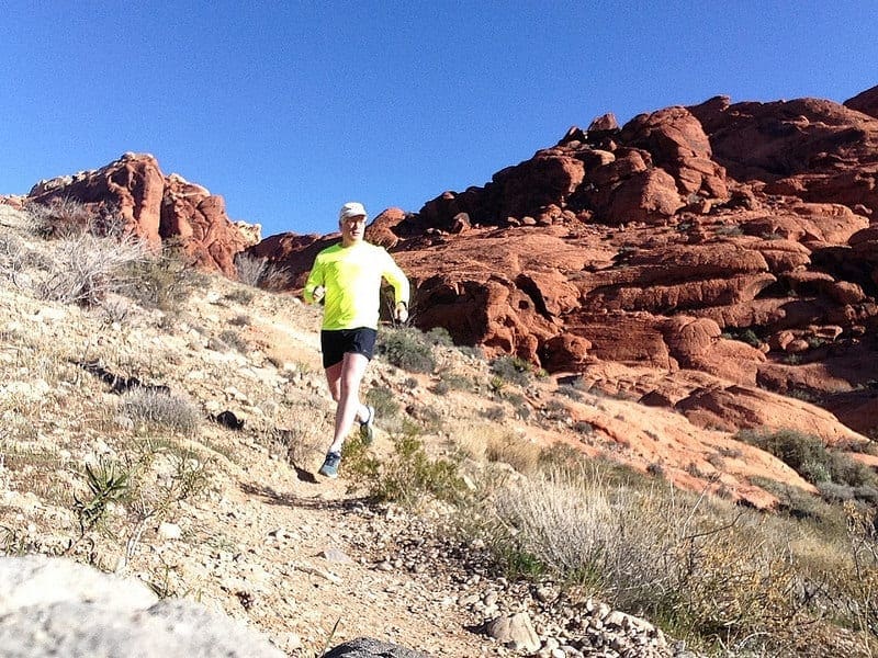 Tom Foreman running amidst the red rock splendor outside of Las Vegas.