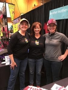 three women at a running expo
