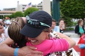 Dimity hugging her coach Bri after the race. Her smile says it all.