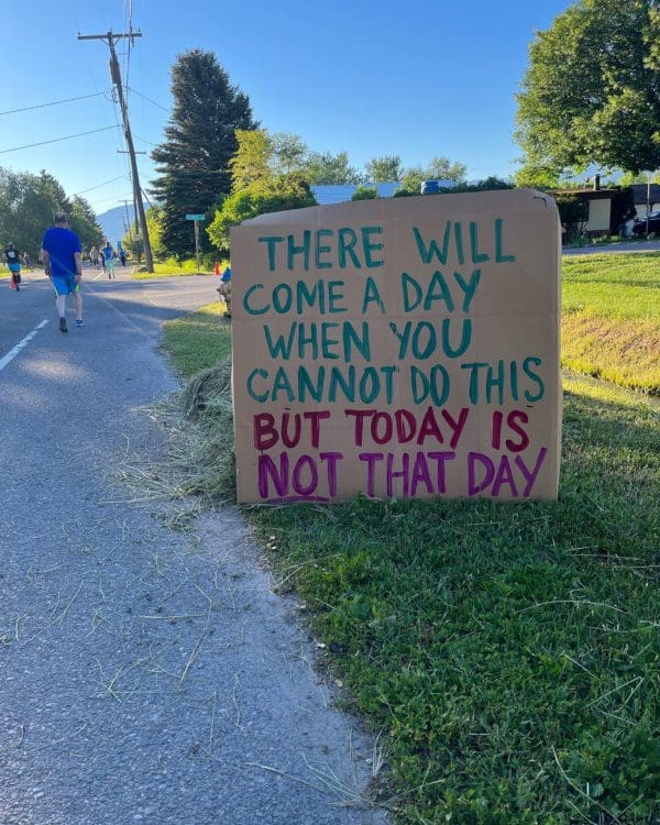 A cardboard sign saying "There will come a day when you cannot do this but today is not that day."