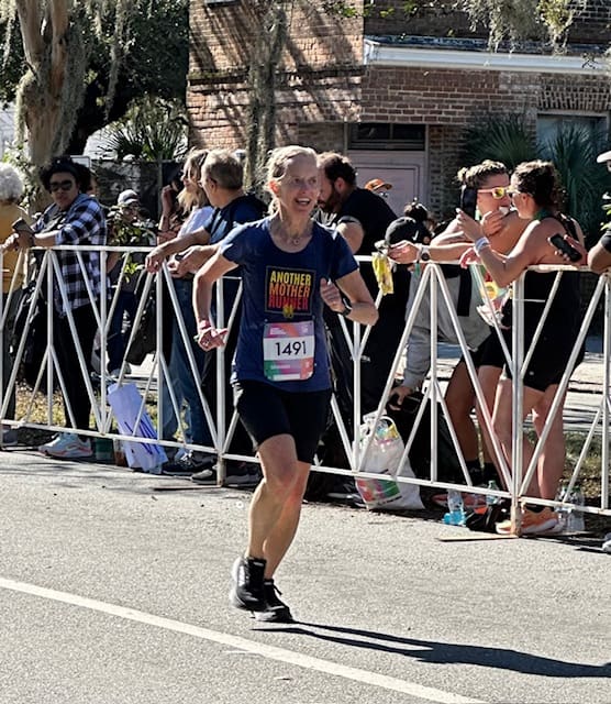 woman finishing Every Woman's marathon in Savannah 